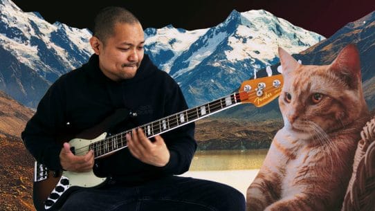 Posido Vega slapping the bass with a cat watching