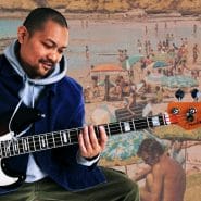 Posido Vega playing chord melody on the bass guitar