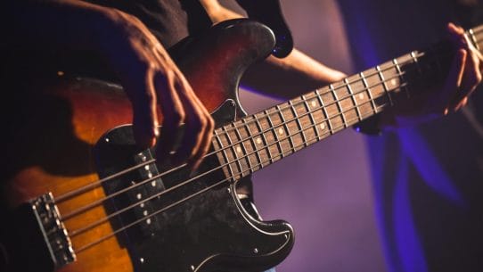 Bass Guitar Techniques - Bass player using fingerstyle technique