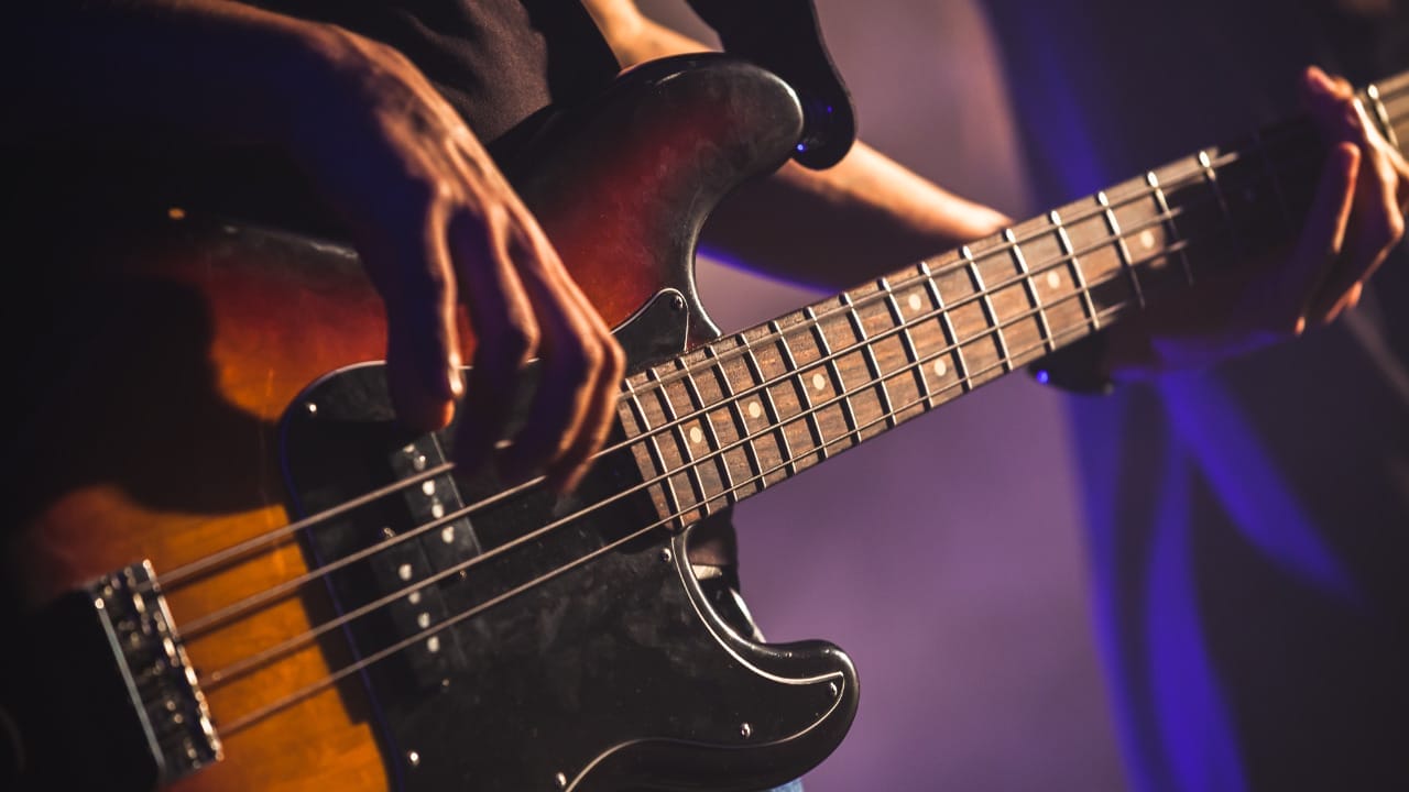 Bass Guitar Techniques - Bass player using fingerstyle technique