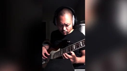 Posido Vega playing the bass at 2AM