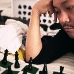 Posido Vega studying chess in bed