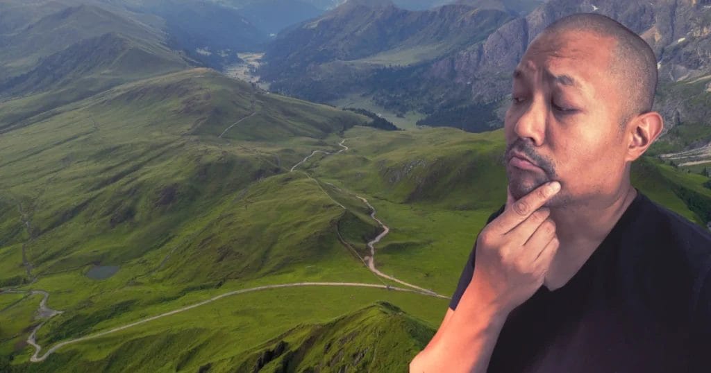 Posido Vega looking down and thinking about a path
