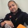 Posido Vega resting with bass guitar